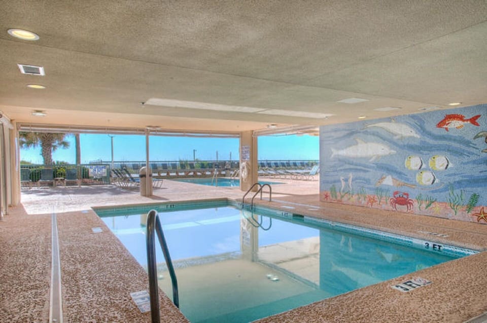 Enjoy swimming in the shade after building sandcastles on the beach.