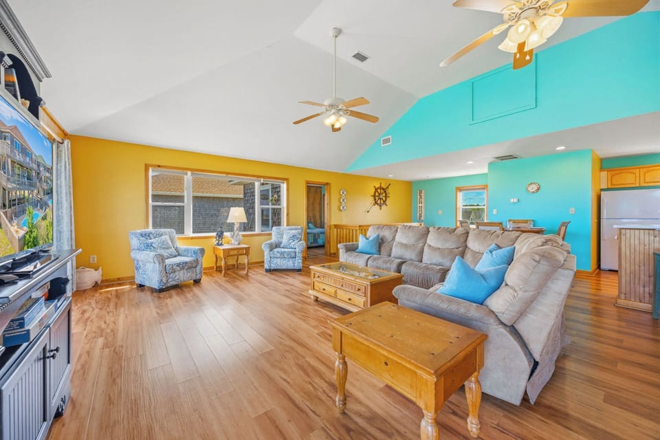 Sink into plush seating and soak in the vibrant, beachy colors—your spacious living area is designed for relaxation and togetherness.