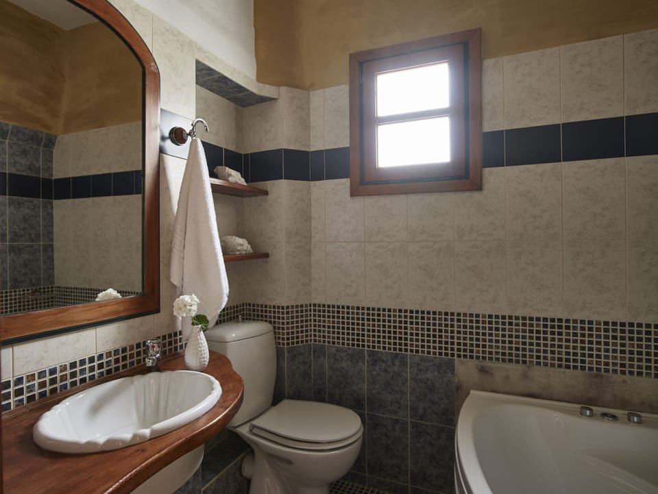 Superior Triple Room | Bathroom | Deep soaking tub, rainfall showerhead, hair dryer, towels