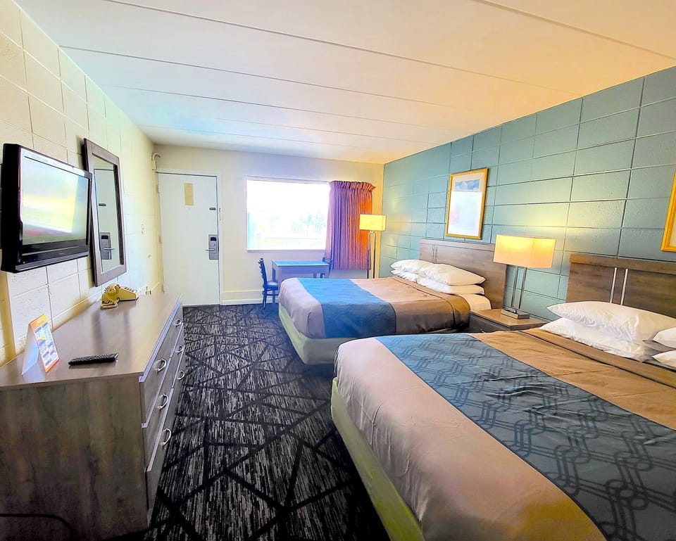 Standard Room, 2 Queen Beds, Pool View (4 People) | In-room safe, free WiFi, bed sheets