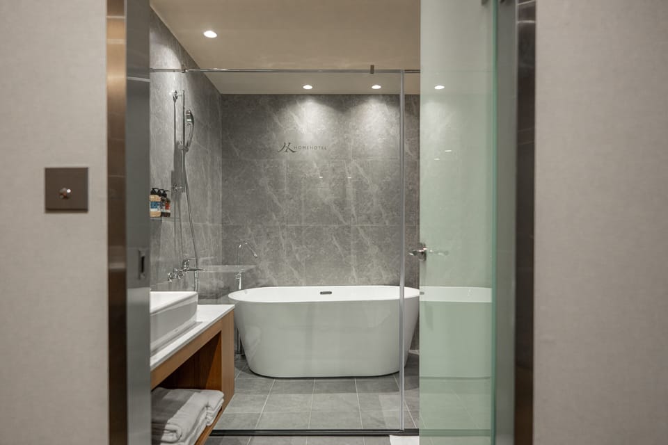 Deluxe Room, 2 Queen Beds, Terrace, City View | Bathroom | Hair dryer, bathrobes, slippers, towels