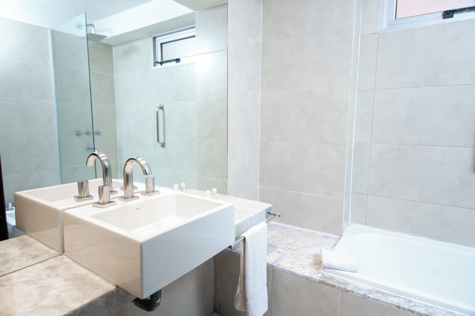 Bathtub, hair dryer, towels