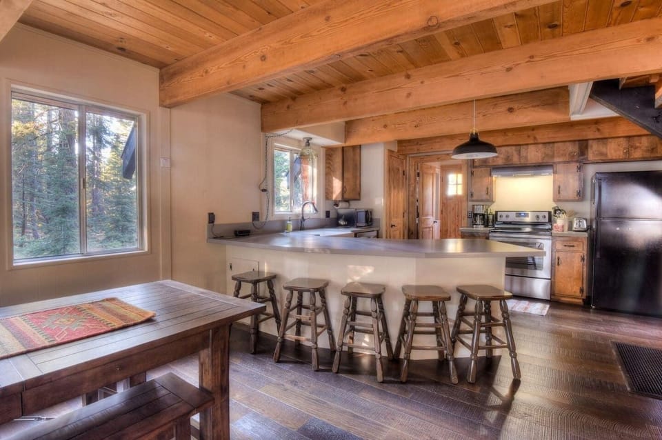 The kitchen is equipped with a drip coffee top, electric stovetop.