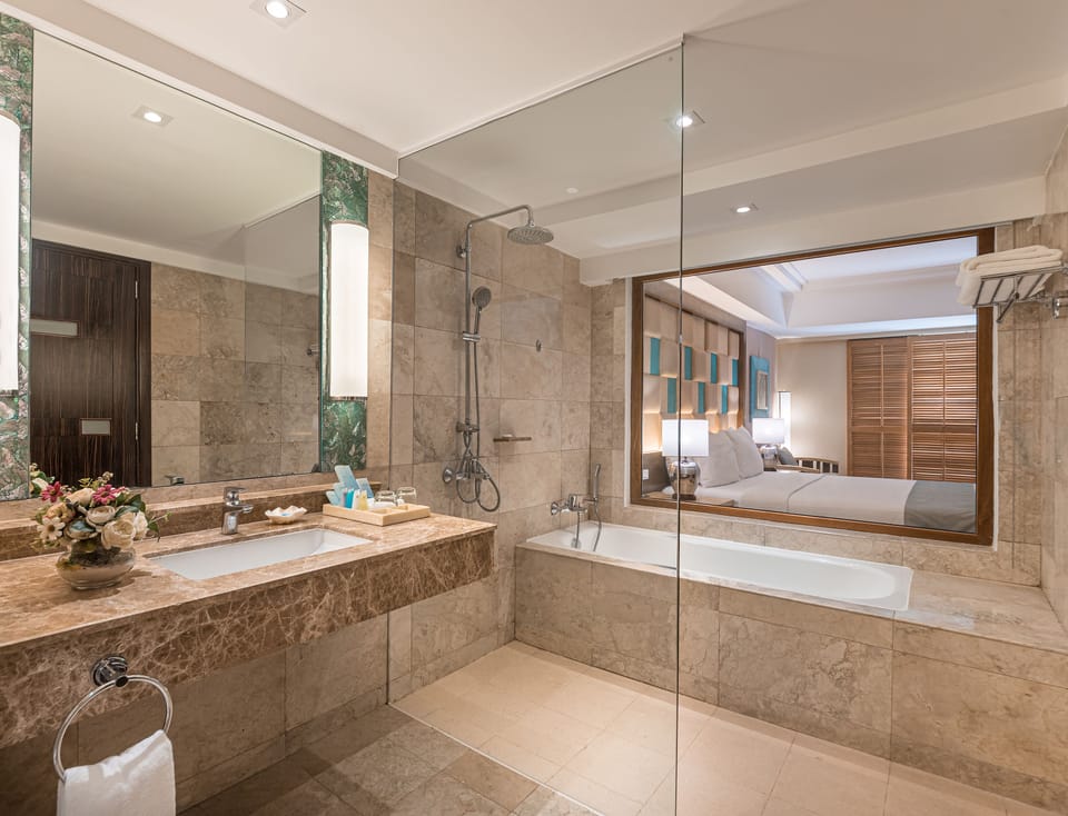 Designer toiletries, hair dryer, slippers, bidet