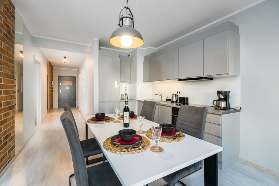 Large table with chairs for eating communal meals. 