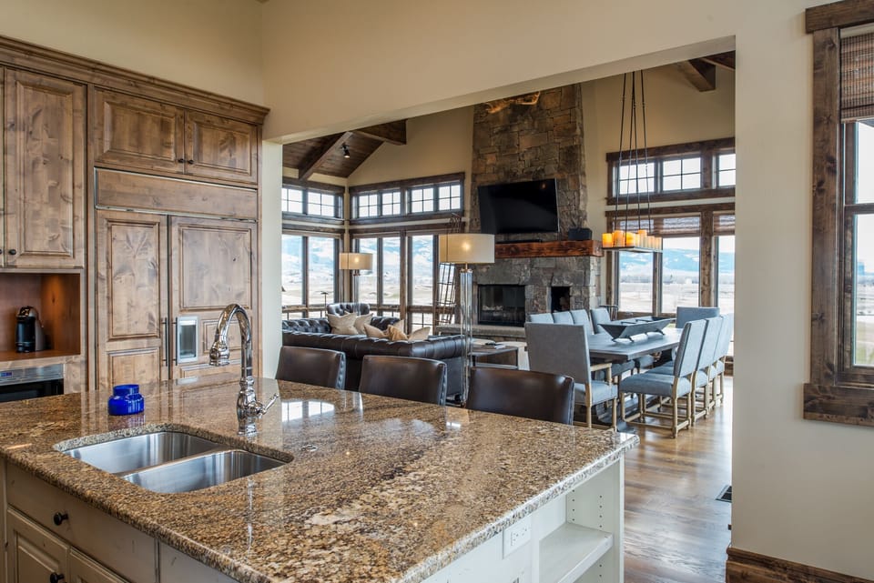 Your gourmet kitchen opens seamlessly to a cozy living space where you can cook, dine, and relax all in one beautiful flow. Granite counters, rustic wood beams, and mountain views create the perfect backdrop for your getaway.