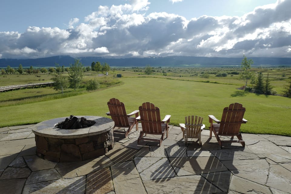 Picture yourself unwinding in these cozy Adirondack chairs around the fire pit, watching clouds drift over the sprawling mountain vista. Your perfect evening awaits with s'mores and stargazing.