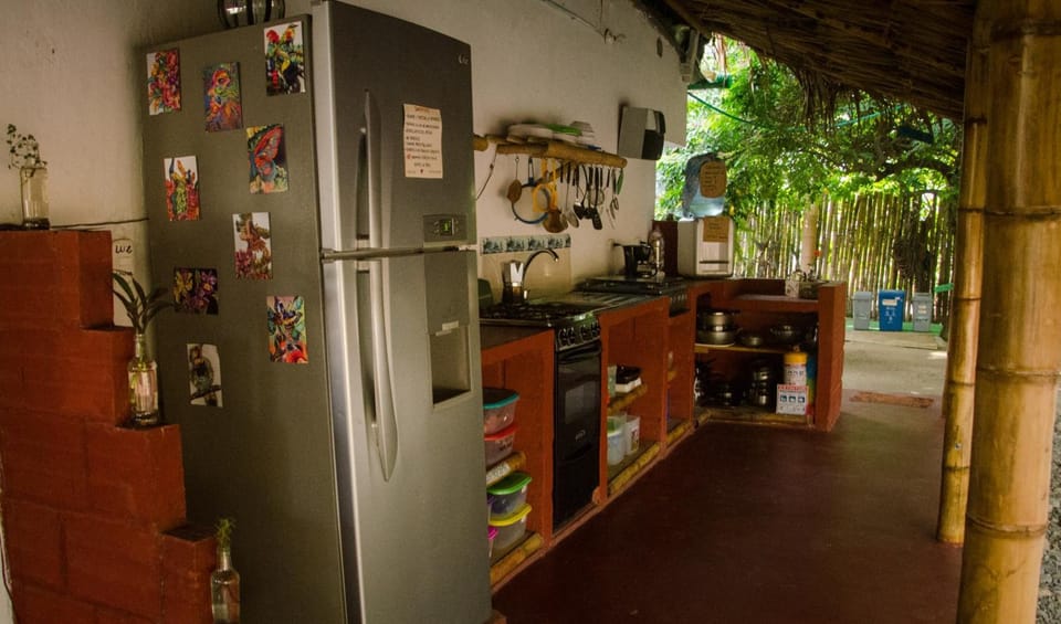 Full-size fridge, oven, cookware/dishes/utensils, cleaning supplies