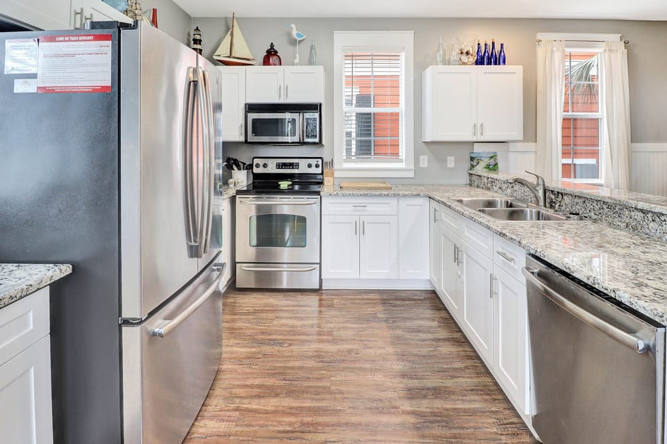 The well equipped kitchen features stainless appliances perfect for preparing family dinners or a quick bite for lunch.
