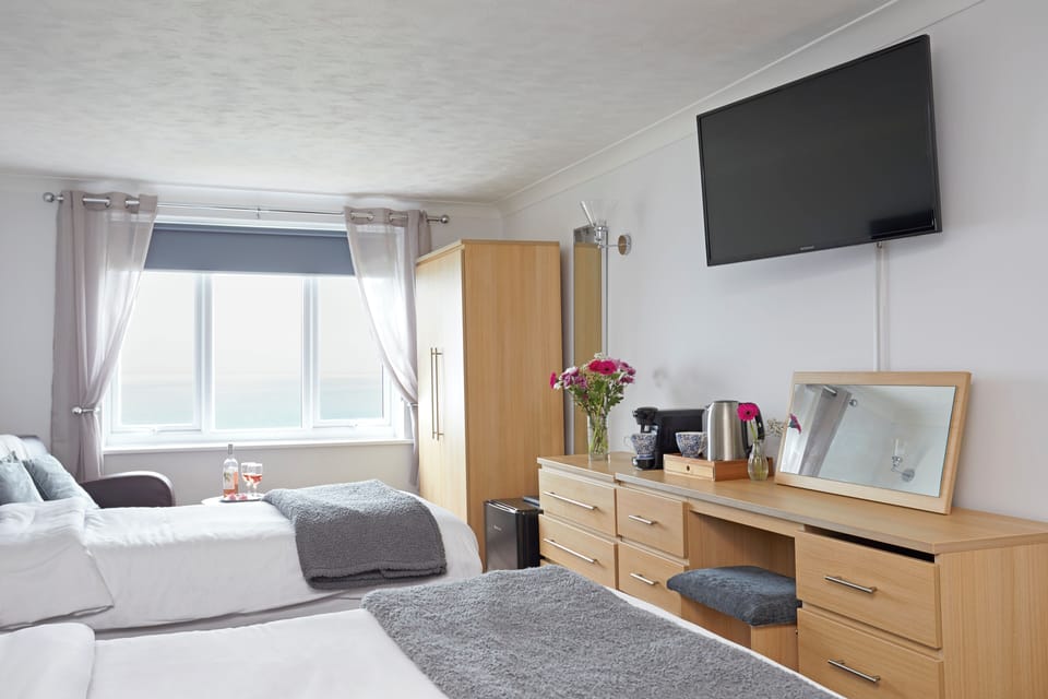 Family Room, Sea View | In-room safe, desk, iron/ironing board, cribs/infant beds