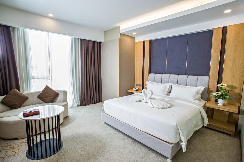 Suite | Desk, laptop workspace, blackout drapes, soundproofing