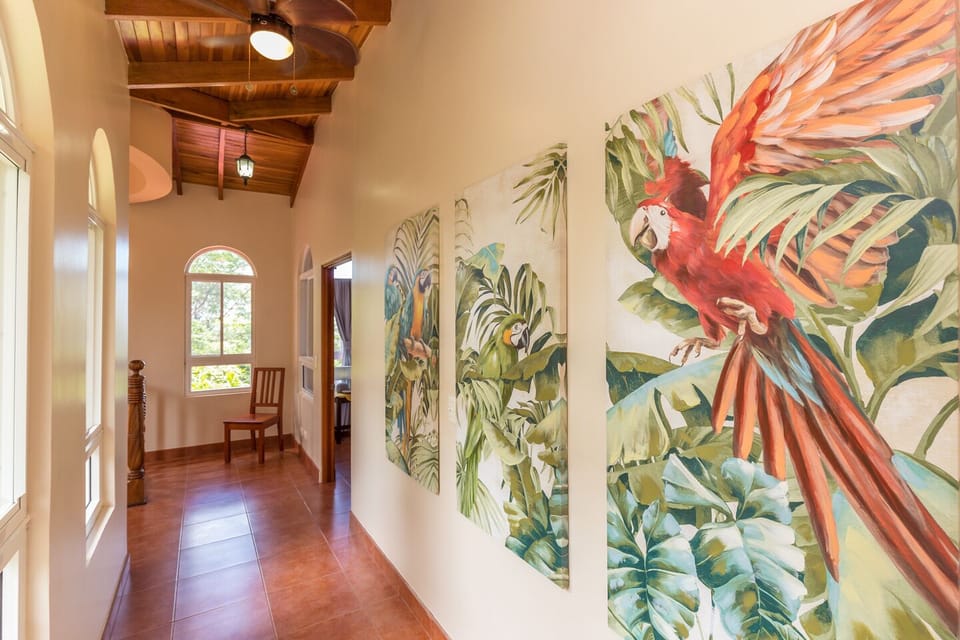 Large hallway separating both master suites with private sitting area