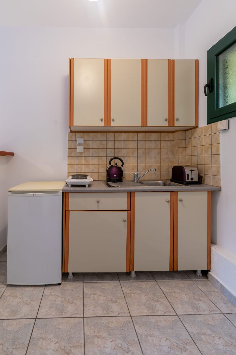 Mini-fridge, stovetop, electric kettle, toaster