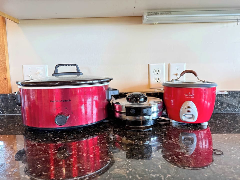 Fully stocked with convenient small appliances like a slow cooker and rice cooker, making home-cooked vacation meals effortless.