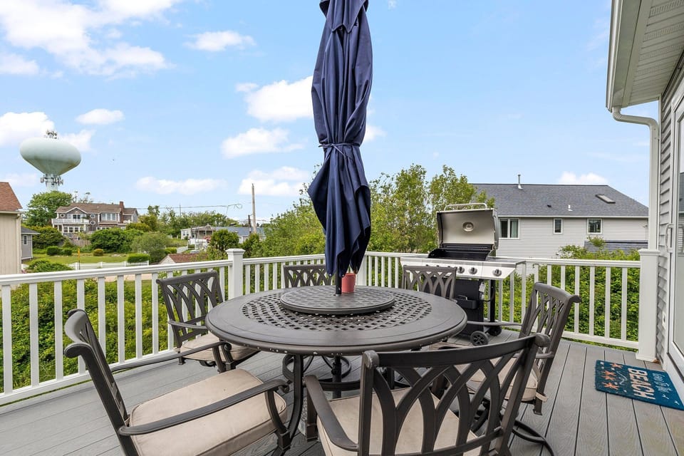 Elevated Deck off Kitchen with Outdoor Seating and Propane Grill