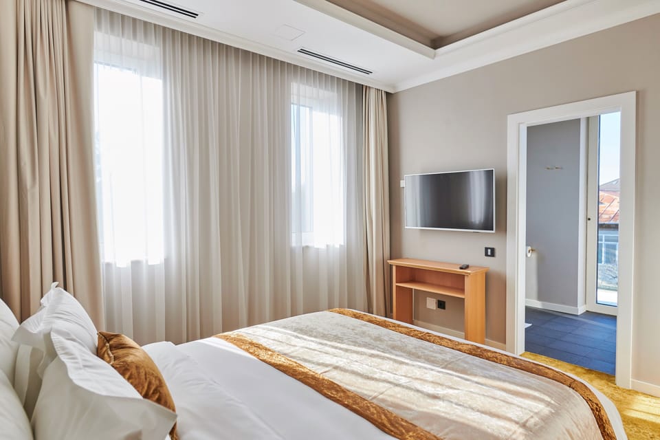 Deluxe Suite, Terrace | Premium bedding, memory foam beds, minibar, desk