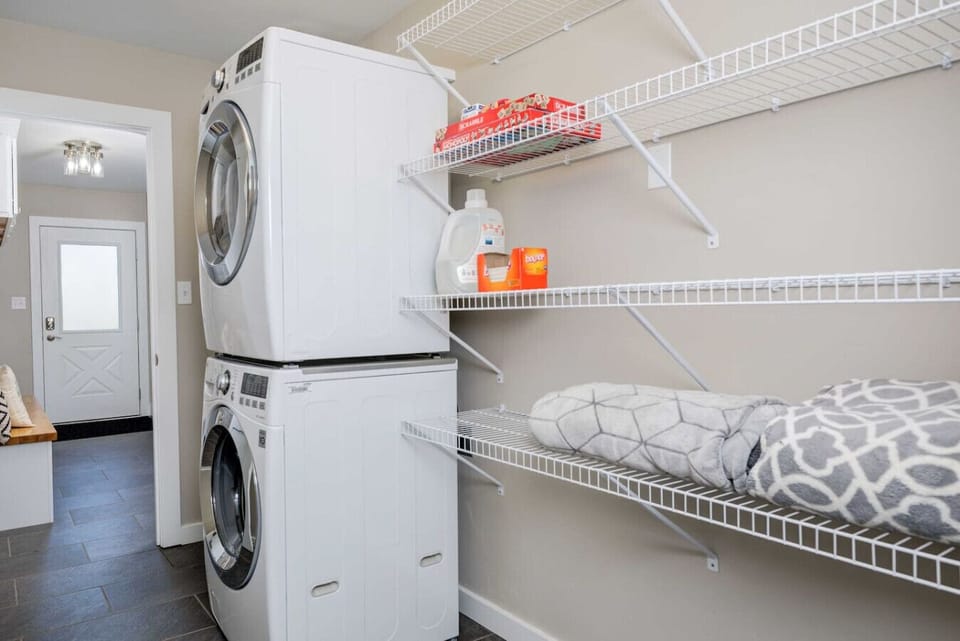 Laundry room with drying rack, laundry detergent and dryer sheets