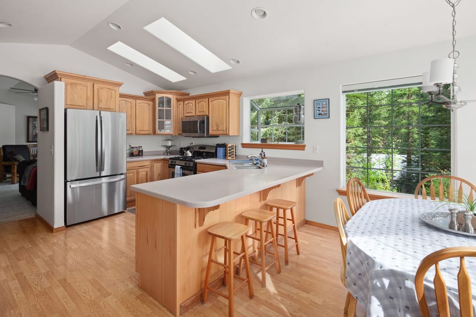 The kitchen is spacious and bright.