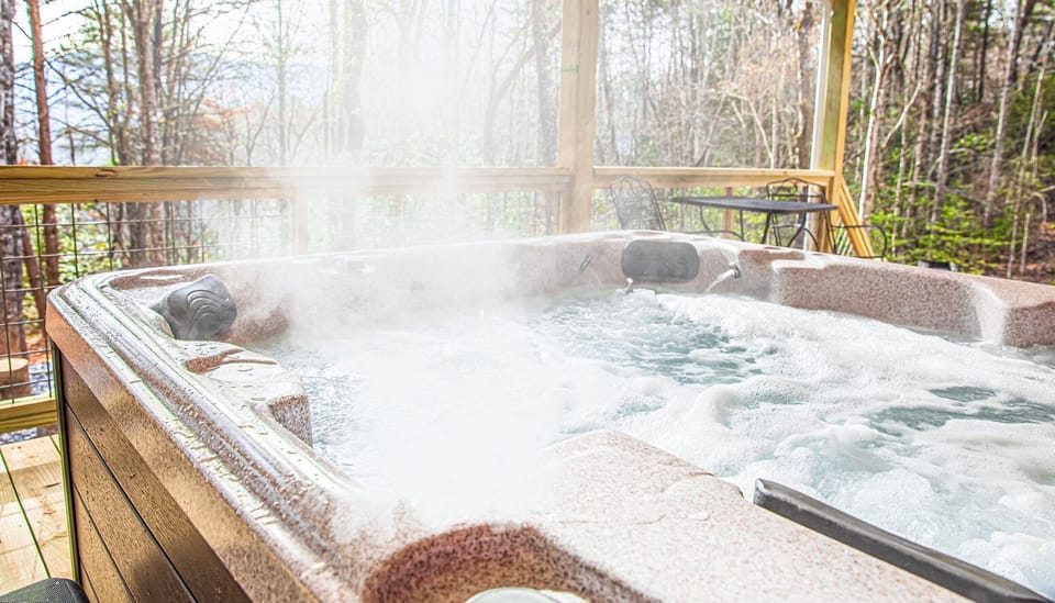 Hot tub on covered porch overlooking mtn vistas when leaves are off the trees