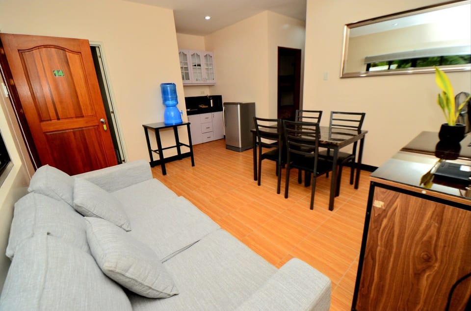 2 BR Apartment Deluxe | Living area | Flat-screen TV
