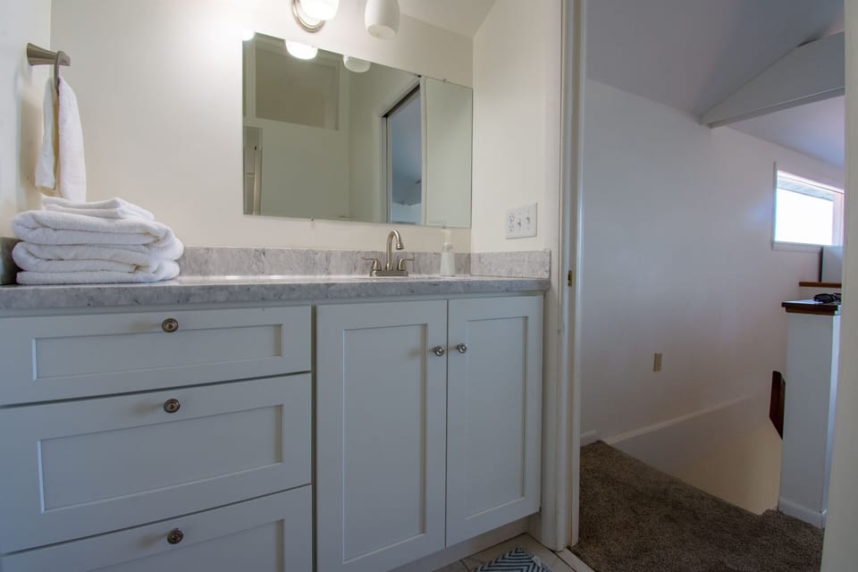 Master suite bathroom, king bed and private deck overlooking Crystal Lake.