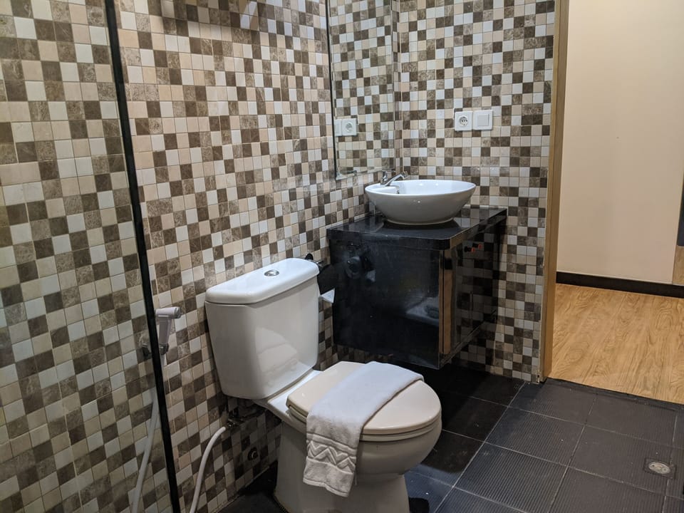 Shower, slippers, towels, soap