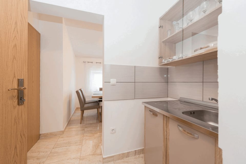 Apartment, 2 Bedrooms A1 | Private kitchen | Full-size fridge, microwave, stovetop, coffee/tea maker