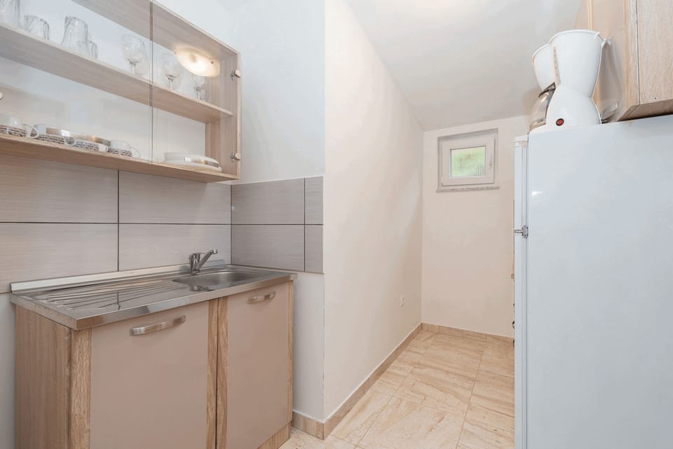 Apartment, 2 Bedrooms A1 | Private kitchen | Full-size fridge, microwave, stovetop, coffee/tea maker