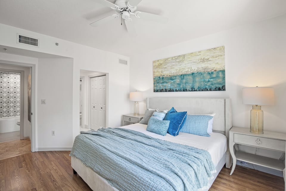 Guest bedroom featuring a king bed, Gulf views, and a private ensuite bathroom for added comfort and convenience.