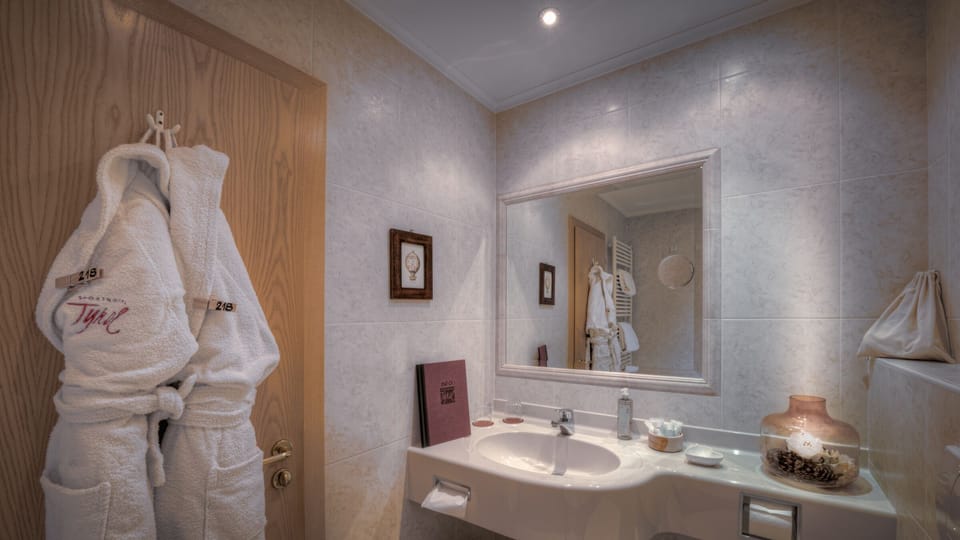 Hair dryer, bathrobes, slippers, towels