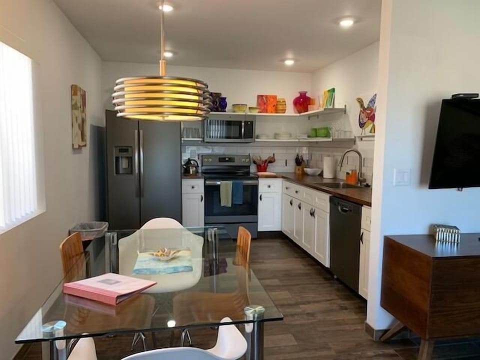 Kitchen area with dining table.