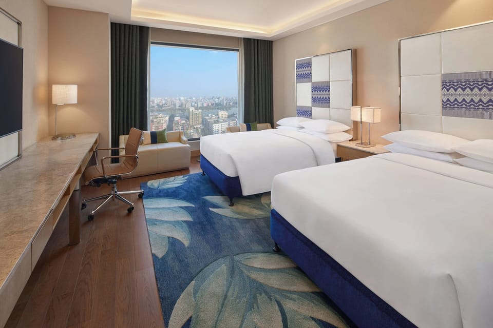 Deluxe Room, 2 Twin Beds | Memory foam beds, minibar, in-room safe, individually decorated