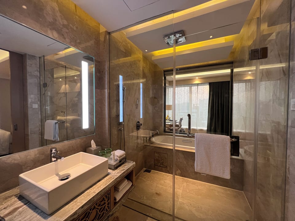 Club Suite, 1 Bedroom | Bathroom | Combined shower/tub, rainfall showerhead, designer toiletries