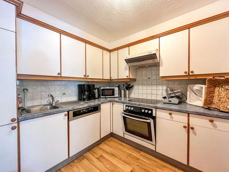 Kitchen, Wood, Flooring, Countertop, Cabinetry, Kitchen Appliance, Interior Design, Floor, Furniture, Major Appliance