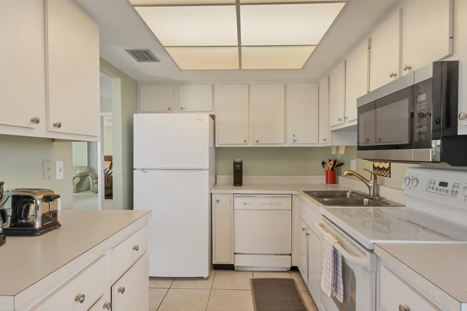 Fully-equipped kitchen with balcony access