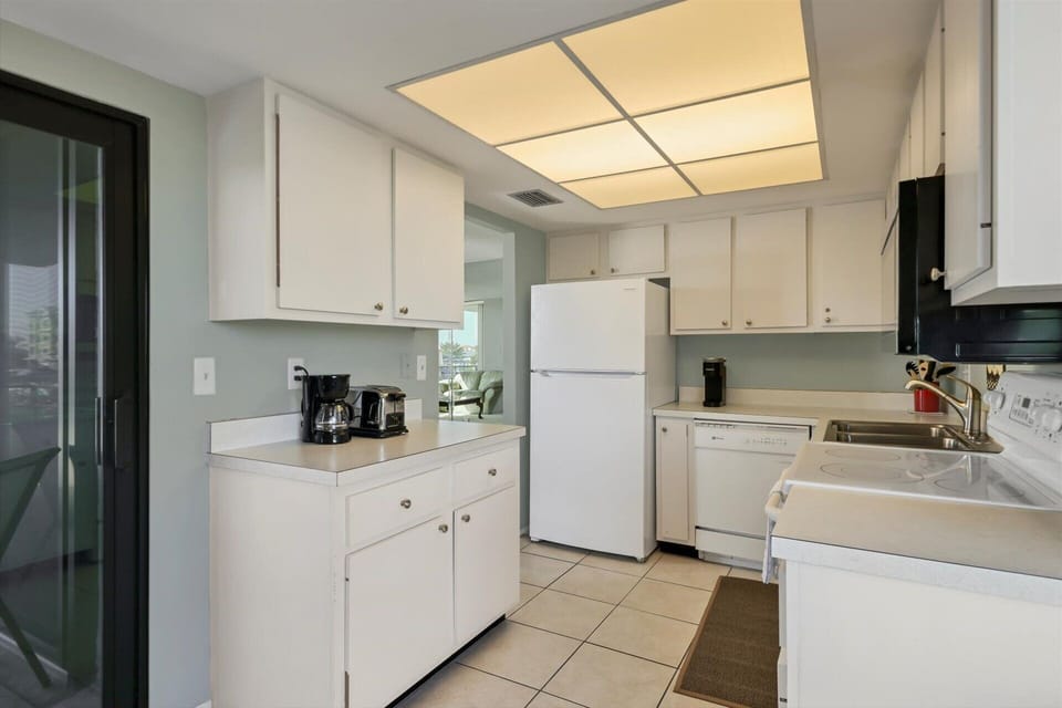 Fully-equipped kitchen with balcony access
