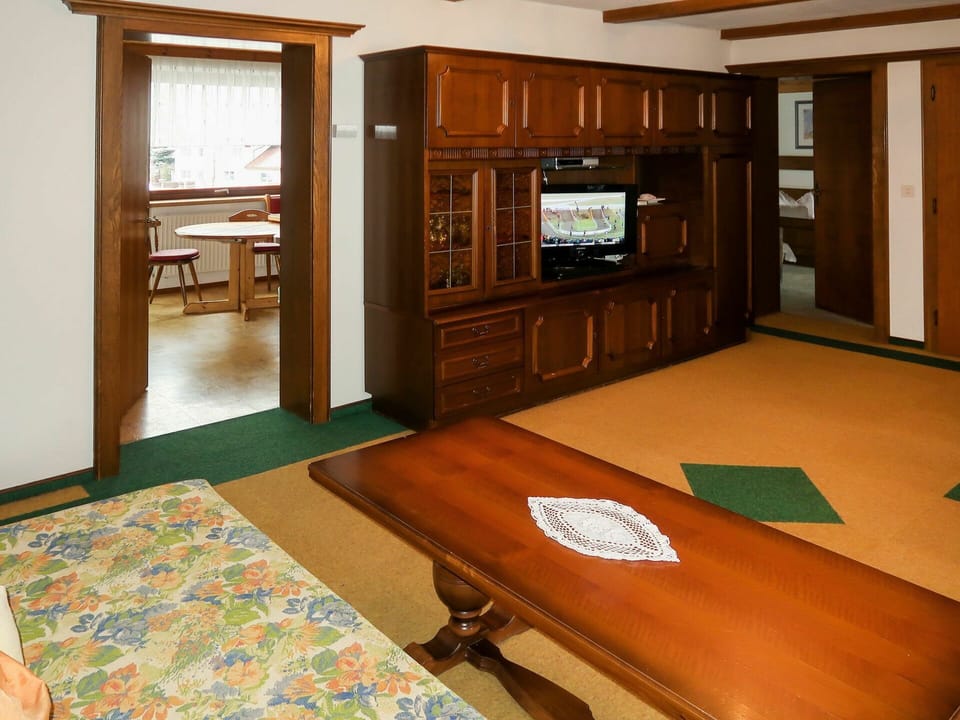 Furniture, Property, Cabinetry, Building, Wood, Table, Television, Interior Design, Flooring, Floor
