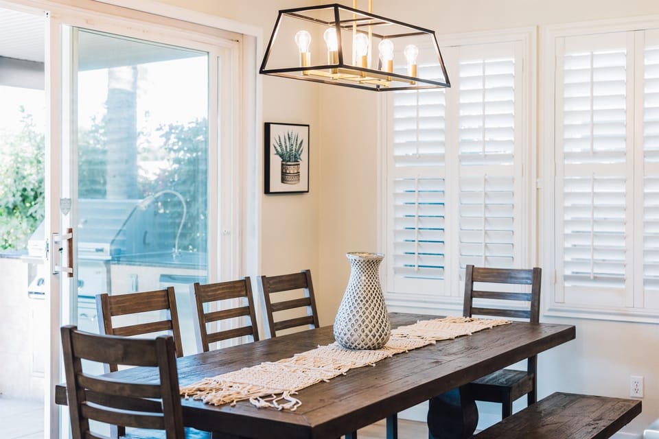 Step into a culinary haven where the kitchen is fully equipped for all your gourmet adventures. Open to a cozy living area and stunning views of the golf course—perfect for relaxing and entertaining.