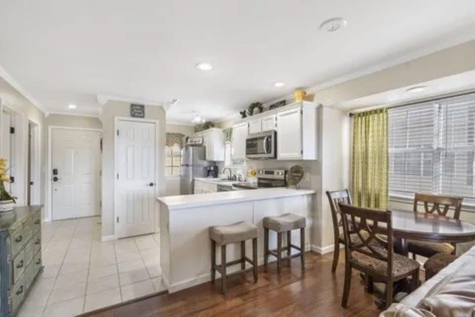Dining area with bar seating - perfect place to spend time with family & friends