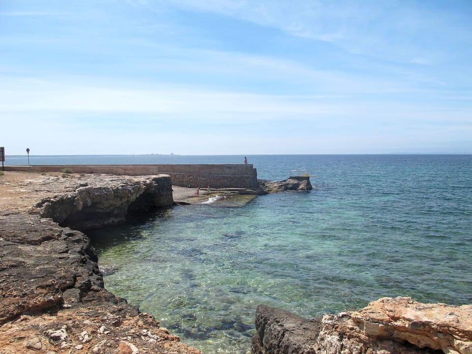 Water, Sky, Daytime, Azure, Building, Coastal And Oceanic Landforms, Body Of Water, Landscape, Beach, Natural Landscape
