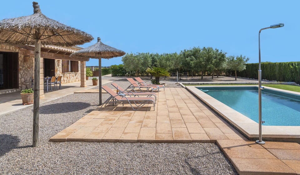 Sky, Water, Shade, Tree, Swimming Pool, Outdoor Furniture, Plant, Street Light, Building, Real Estate