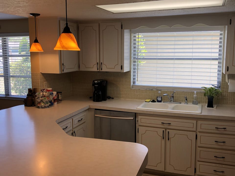Full size Kitchen with stove, microwave, refrigerator, and dishwasher.