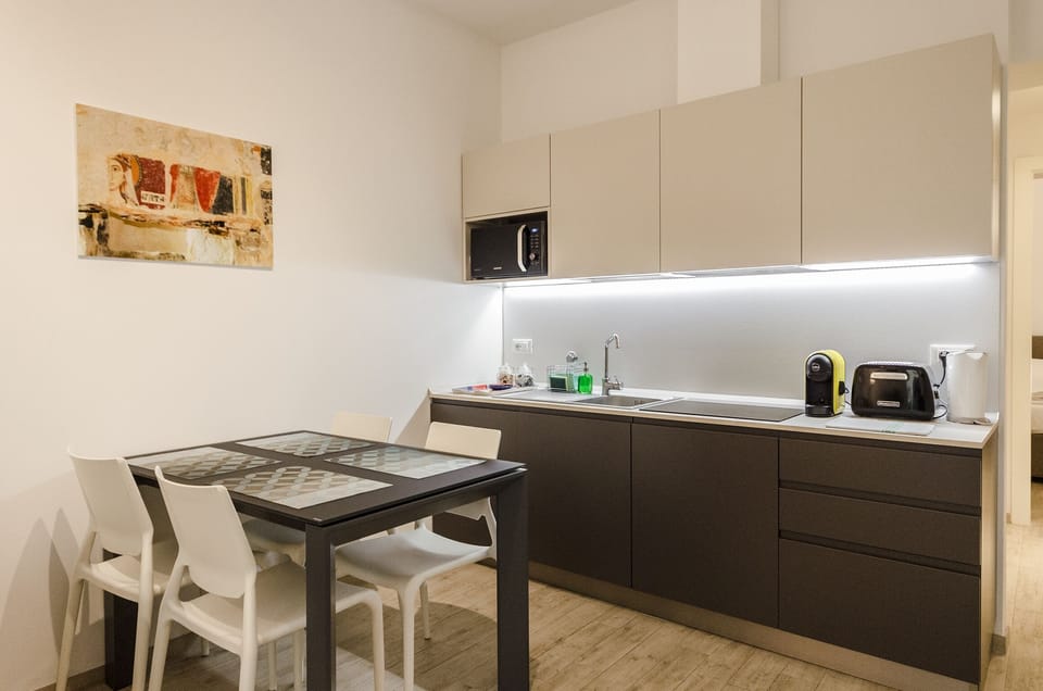 Apartment, 1 Bedroom | Private kitchenette | Fridge, stovetop, dishwasher, electric kettle