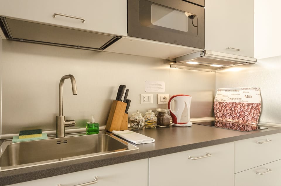 Apartment, 2 Bedrooms | Private kitchenette | Fridge, microwave, stovetop, dishwasher