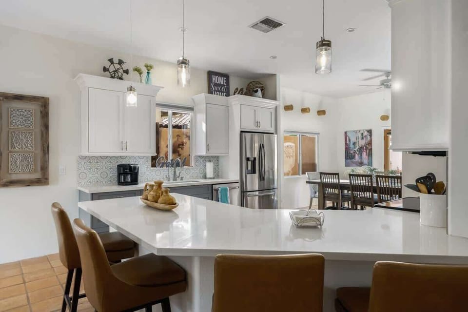 Plenty of seating around the new sparkling kitchen. High spacious ceilings.
