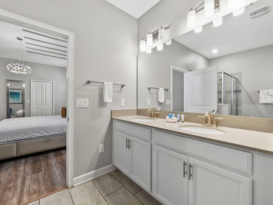Bathroom 2 with a walk-in shower and a bathtub