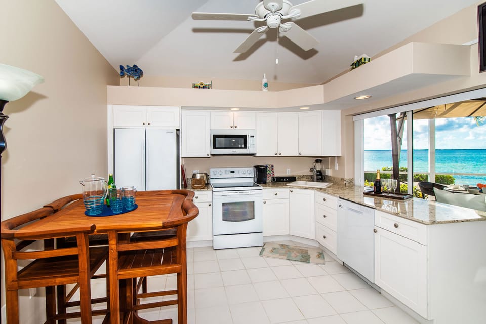 Modern kitchen with a dining table that seats 4.