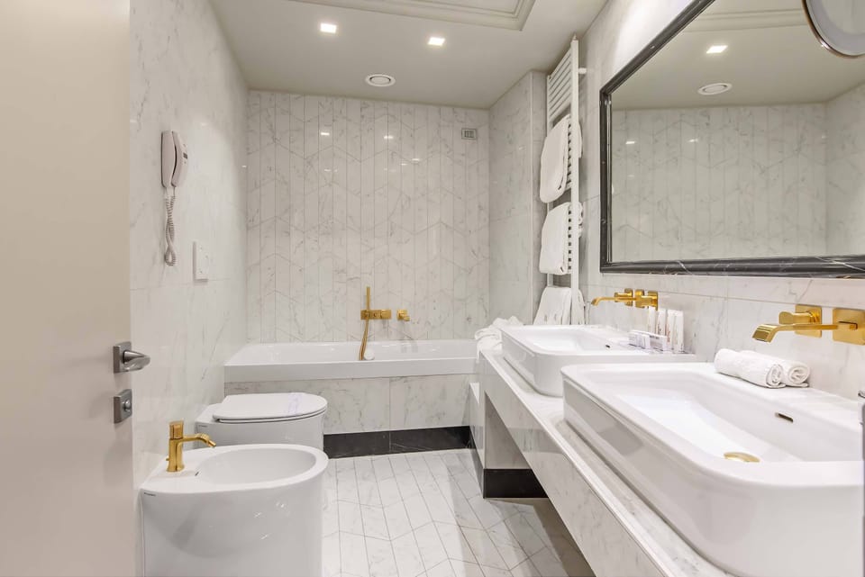 Designer toiletries, hair dryer, bathrobes, slippers