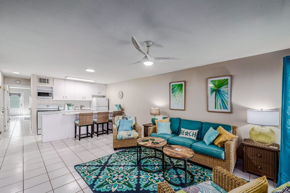 Bright and cheery living room with full murphy bed and AC.