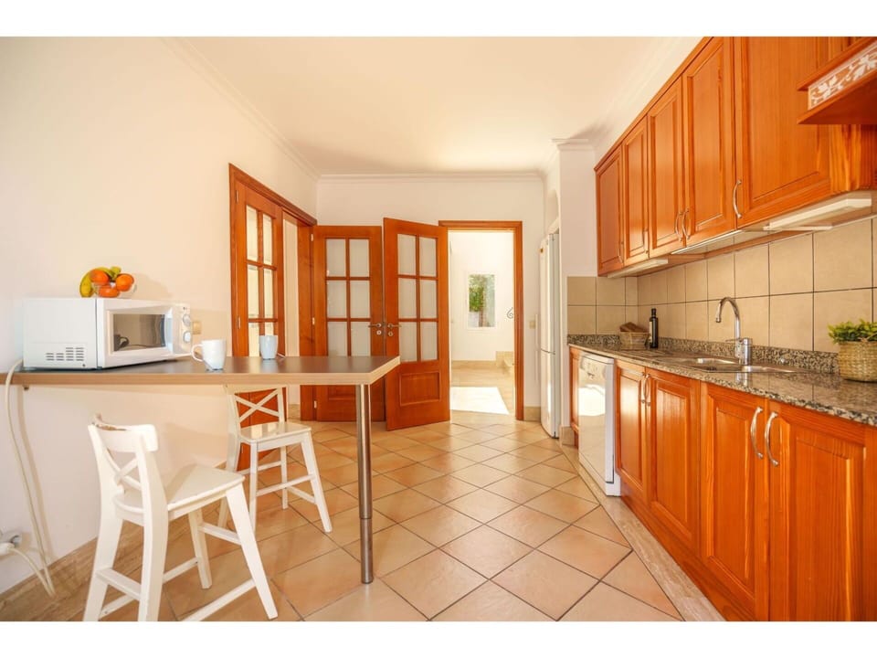 Property, Cabinetry, Furniture, Table, Orange, Countertop, Lighting, Chair, Wood, Interior Design